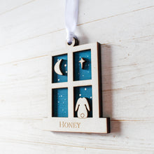 Load image into Gallery viewer, Decorative white wooden window with cut-out shapes of a moon, star, and lop eared rabbit on a blue wooden background