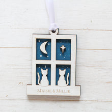 Load image into Gallery viewer, Decorative hanging ornament with cat and moon design on a white wooden surface
